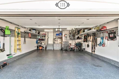 115 Cougarstone Square Sw, Calgary, AB - Indoor Photo Showing Garage
