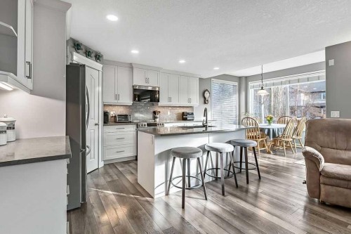 115 Cougarstone Square Sw, Calgary, AB - Indoor Photo Showing Kitchen With Upgraded Kitchen