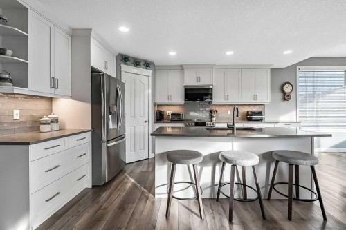 115 Cougarstone Square Sw, Calgary, AB - Indoor Photo Showing Kitchen With Upgraded Kitchen