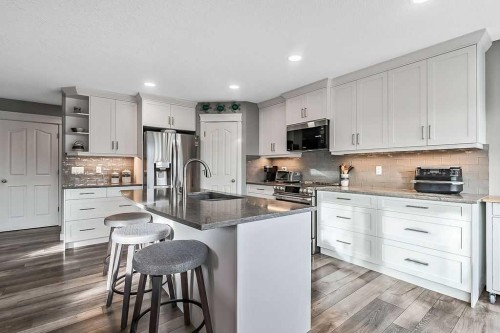 115 Cougarstone Square Sw, Calgary, AB - Indoor Photo Showing Kitchen With Upgraded Kitchen
