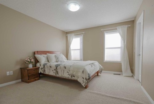 125 Silverado Range Cove Sw, Calgary, AB - Indoor Photo Showing Bedroom