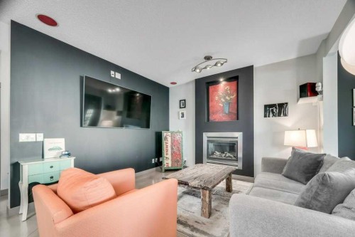 26 Copperfield Common Se, Calgary, AB - Indoor Photo Showing Living Room With Fireplace