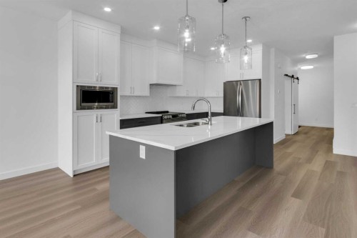 137 Copperhead Road Se, Calgary, AB - Indoor Photo Showing Kitchen With Double Sink With Upgraded Kitchen