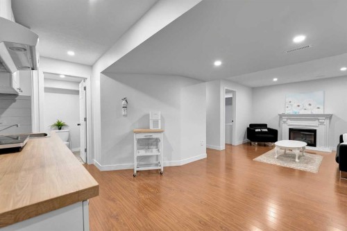 60 Saddlecrest Green Ne, Calgary, AB - Indoor With Fireplace