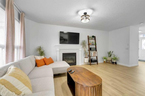 60 Saddlecrest Green Ne, Calgary, AB - Indoor Photo Showing Living Room With Fireplace