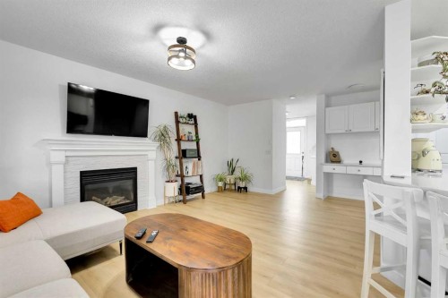 60 Saddlecrest Green Ne, Calgary, AB - Indoor Photo Showing Living Room With Fireplace