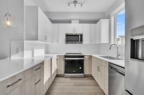 363-301 Redstone Boulevard Ne, Calgary, AB - Indoor Photo Showing Kitchen With Stainless Steel Kitchen With Double Sink With Upgraded Kitchen