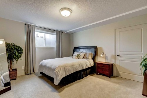 566 Pine Creek Ridge, Heritage Pointe, AB - Indoor Photo Showing Bedroom