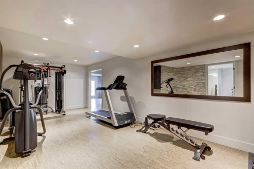 566 Pine Creek Ridge, Heritage Pointe, AB - Indoor Photo Showing Gym Room