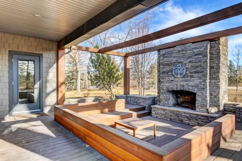 566 Pine Creek Ridge, Heritage Pointe, AB - Outdoor With Fireplace With Deck Patio Veranda With Exterior