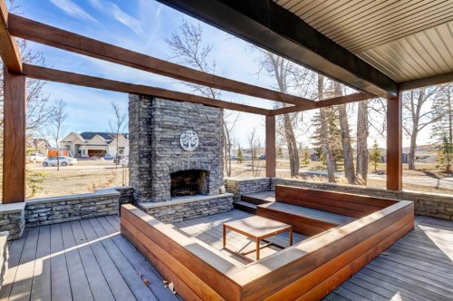 566 Pine Creek Ridge, Heritage Pointe, AB - Outdoor With Fireplace With Deck Patio Veranda