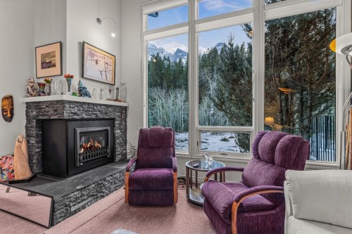 7-1017 Olympic Drive, Canmore, AB - Indoor Photo Showing Living Room With Fireplace