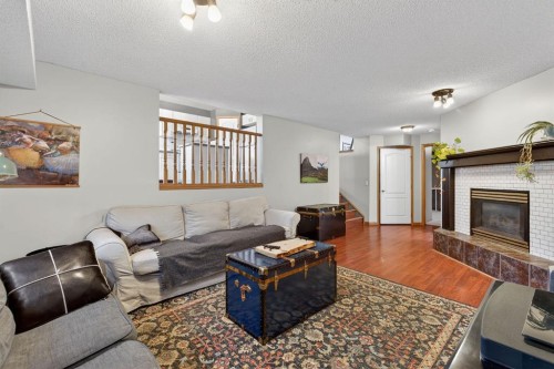 68 Coventry Green Ne, Calgary, AB - Indoor Photo Showing Living Room With Fireplace