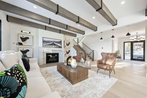 2755 Cannon Road Nw, Calgary, AB - Indoor Photo Showing Living Room With Fireplace