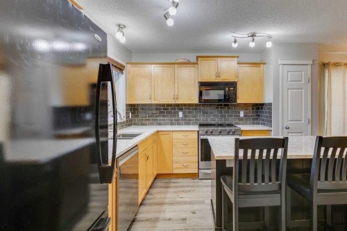 199 Everglen Way Sw, Calgary, AB - Indoor Photo Showing Kitchen With Double Sink