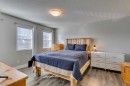 199 Everglen Way Sw, Calgary, AB  - Indoor Photo Showing Bedroom 