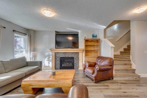 199 Everglen Way Sw, Calgary, AB - Indoor Photo Showing Living Room With Fireplace