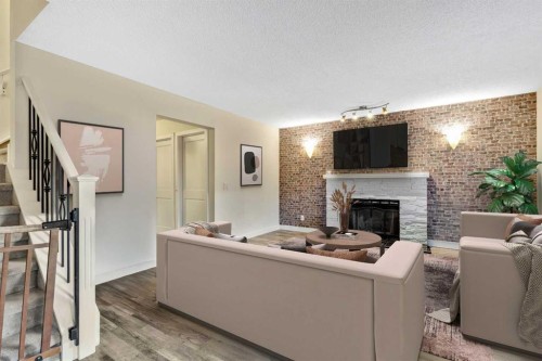 224 Macewan Ridge Close Nw, Calgary, AB - Indoor Photo Showing Living Room With Fireplace