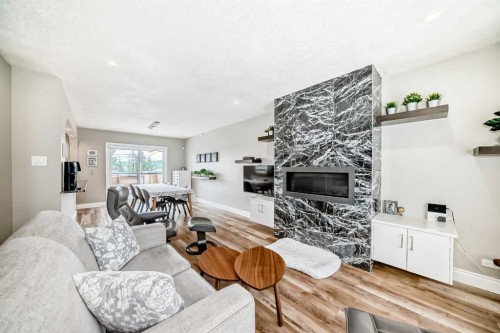 2415 9 Avenue Nw, Calgary, AB - Indoor Photo Showing Living Room With Fireplace