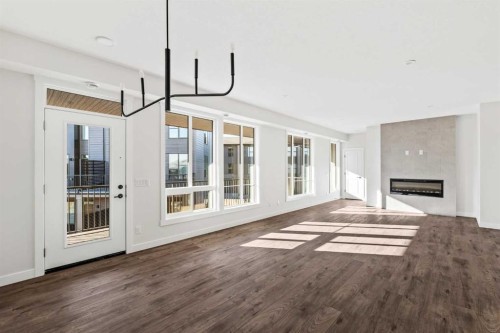 609 Sovereign Common Sw, Calgary, AB - Indoor Photo Showing Other Room With Fireplace