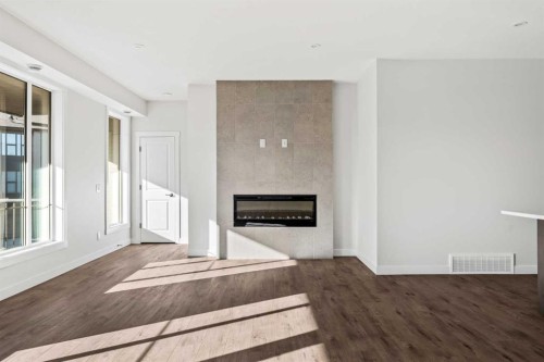 609 Sovereign Common Sw, Calgary, AB - Indoor Photo Showing Living Room With Fireplace