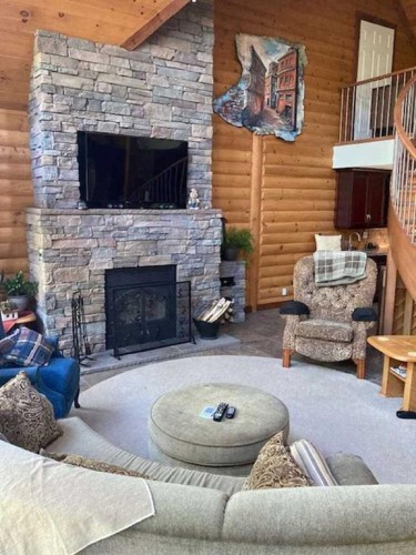 105-433042 Range Road 221, Rural Ponoka County, AB - Indoor Photo Showing Living Room With Fireplace