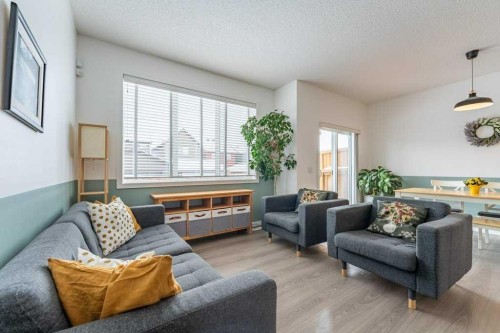 74 Evansridge Crescent Nw, Calgary, AB - Indoor Photo Showing Living Room