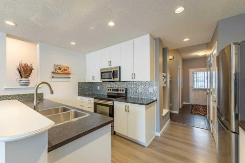 74 Evansridge Crescent Nw, Calgary, AB - Indoor Photo Showing Kitchen With Stainless Steel Kitchen With Double Sink