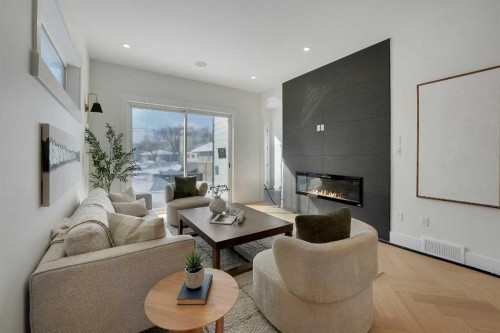 2413 25 Avenue Nw, Calgary, AB - Indoor Photo Showing Living Room With Fireplace