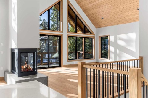 28 Blue Grouse Ridge, Canmore, AB - Indoor Photo Showing Other Room With Fireplace