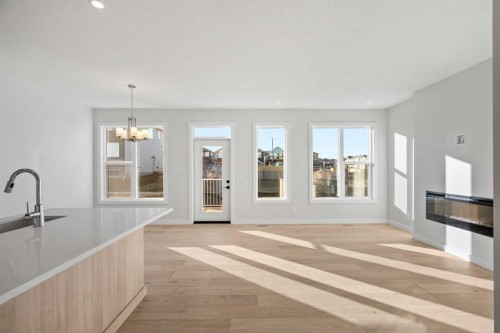63 Creekstone Common Sw, Calgary, AB - Indoor With Fireplace
