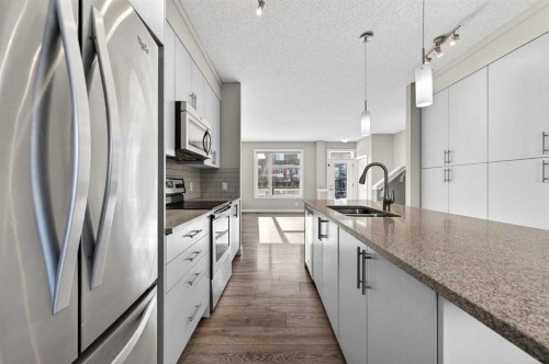 30 Sage Bluff Gate Nw, Calgary, AB - Indoor Photo Showing Kitchen With Stainless Steel Kitchen With Double Sink With Upgraded Kitchen