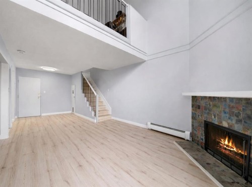 104-1817 14A Street Sw, Calgary, AB - Indoor With Fireplace