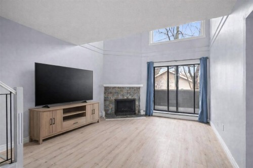 104-1817 14A Street Sw, Calgary, AB - Indoor Photo Showing Living Room With Fireplace