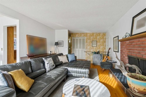 10712 Mapleshire Crescent Se, Calgary, AB - Indoor Photo Showing Living Room With Fireplace