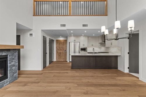 405-1505 Spring Creek Gate, Canmore, AB - Indoor With Fireplace
