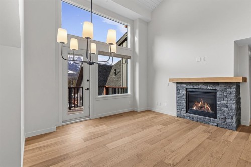 405-1505 Spring Creek Gate, Canmore, AB - Indoor Photo Showing Living Room With Fireplace