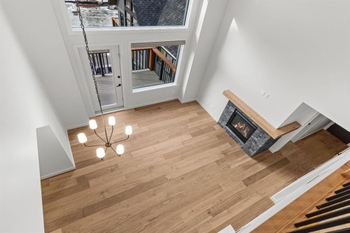 405-1505 Spring Creek Gate, Canmore, AB - Indoor Photo Showing Other Room With Fireplace