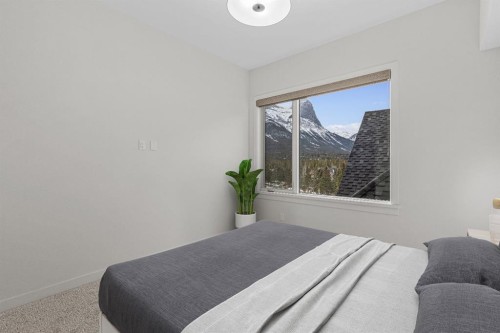 405-1505 Spring Creek Gate, Canmore, AB - Indoor Photo Showing Bedroom