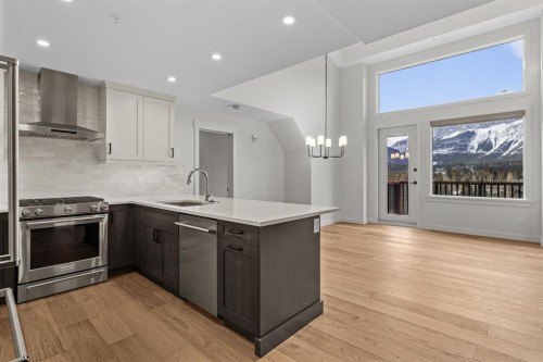 405-1505 Spring Creek Gate, Canmore, AB - Indoor Photo Showing Kitchen With Stainless Steel Kitchen With Upgraded Kitchen