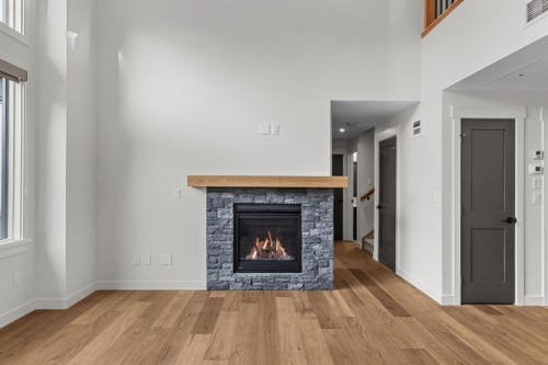 405-1505 Spring Creek Gate, Canmore, AB - Indoor Photo Showing Living Room With Fireplace