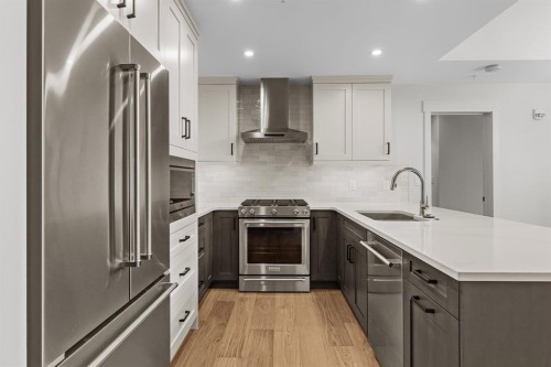 405-1505 Spring Creek Gate, Canmore, AB - Indoor Photo Showing Kitchen With Stainless Steel Kitchen With Upgraded Kitchen