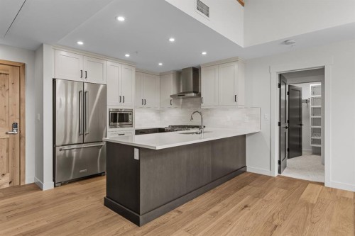 405-1505 Spring Creek Gate, Canmore, AB - Indoor Photo Showing Kitchen With Stainless Steel Kitchen With Upgraded Kitchen