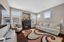 253 Chaparral Valley Drive Se, Calgary, AB  - Indoor Photo Showing Living Room With Fireplace 
