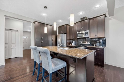 253 Chaparral Valley Drive Se, Calgary, AB - Indoor Photo Showing Kitchen With Stainless Steel Kitchen With Double Sink With Upgraded Kitchen