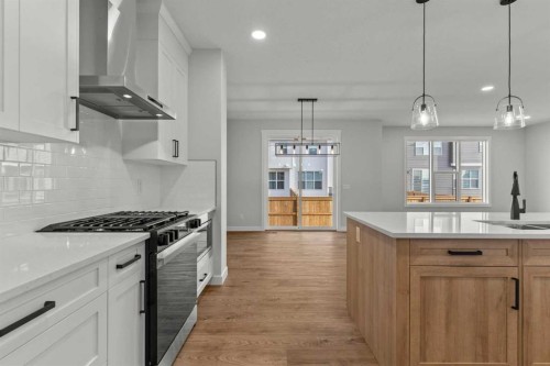 263 Kinniburgh Loop, Chestermere, AB - Indoor Photo Showing Kitchen With Upgraded Kitchen