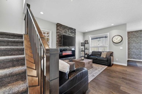 143 Cranarch Crescent Se, Calgary, AB - Indoor Photo Showing Living Room With Fireplace