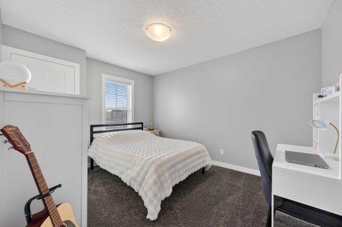 143 Cranarch Crescent Se, Calgary, AB - Indoor Photo Showing Bedroom
