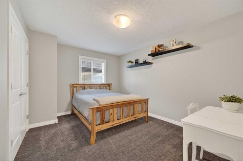 143 Cranarch Crescent Se, Calgary, AB - Indoor Photo Showing Bedroom