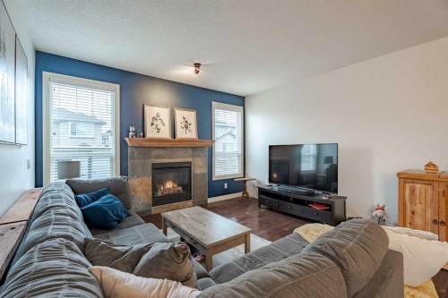2937 Prairie Springs Grove Sw, Airdrie, AB - Indoor Photo Showing Living Room With Fireplace
